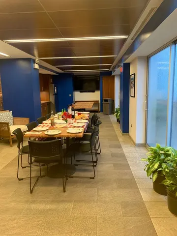 a outdoor dining space with furniture and a potted plant