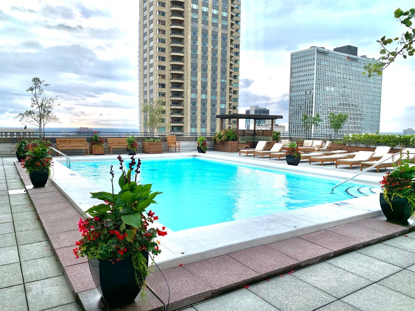 777 North Michigan Avenue, Unit 270002 Chicago, IL 60611 - Photo 5 of 24 a view of a swimming pool with a lounge chairs