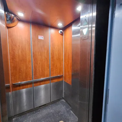 a view of an empty room with a fireplace