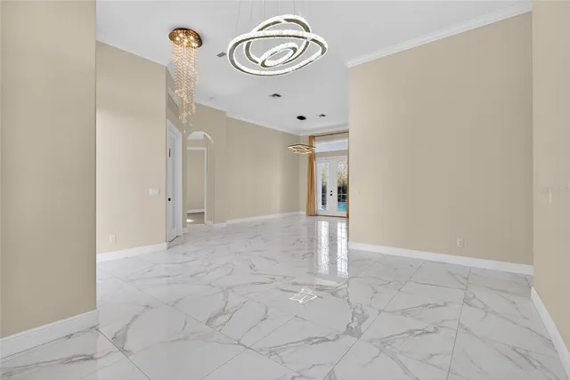 a view of an empty room with glass door