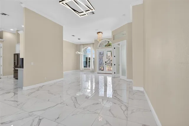 a kitchen with stainless steel appliances a refrigerator sink and cabinets