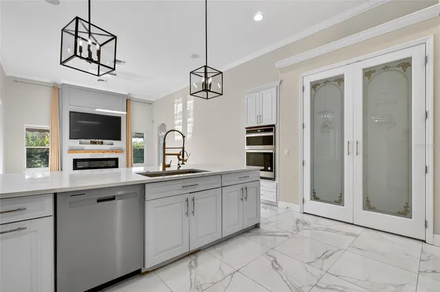 a kitchen with cabinets appliances and a counter top