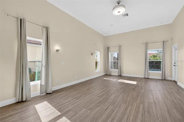 a view of a hallway with a livingroom and a bathroom