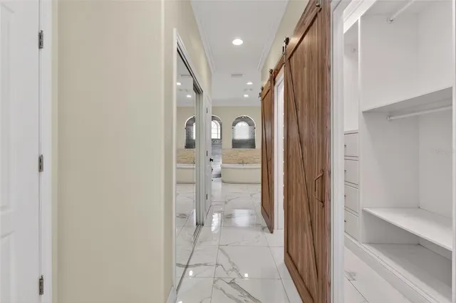 a bathroom with a double vanity sink mirror and bathtub
