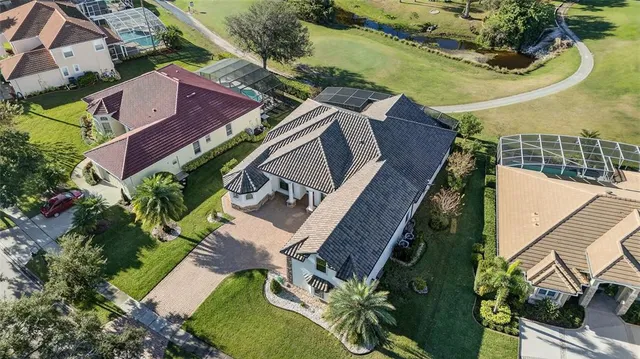 an aerial view of houses with outdoor space