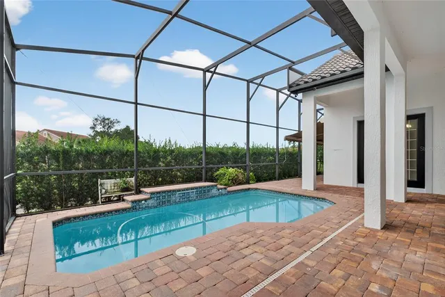 a view of a swimming pool with a porch