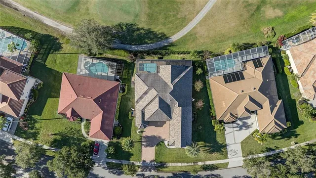 an aerial view of a house having yard swimming pool and outdoor seating