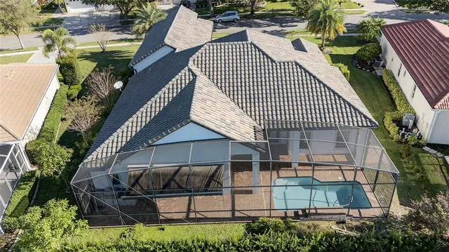 a view of a house with backyard and sitting area