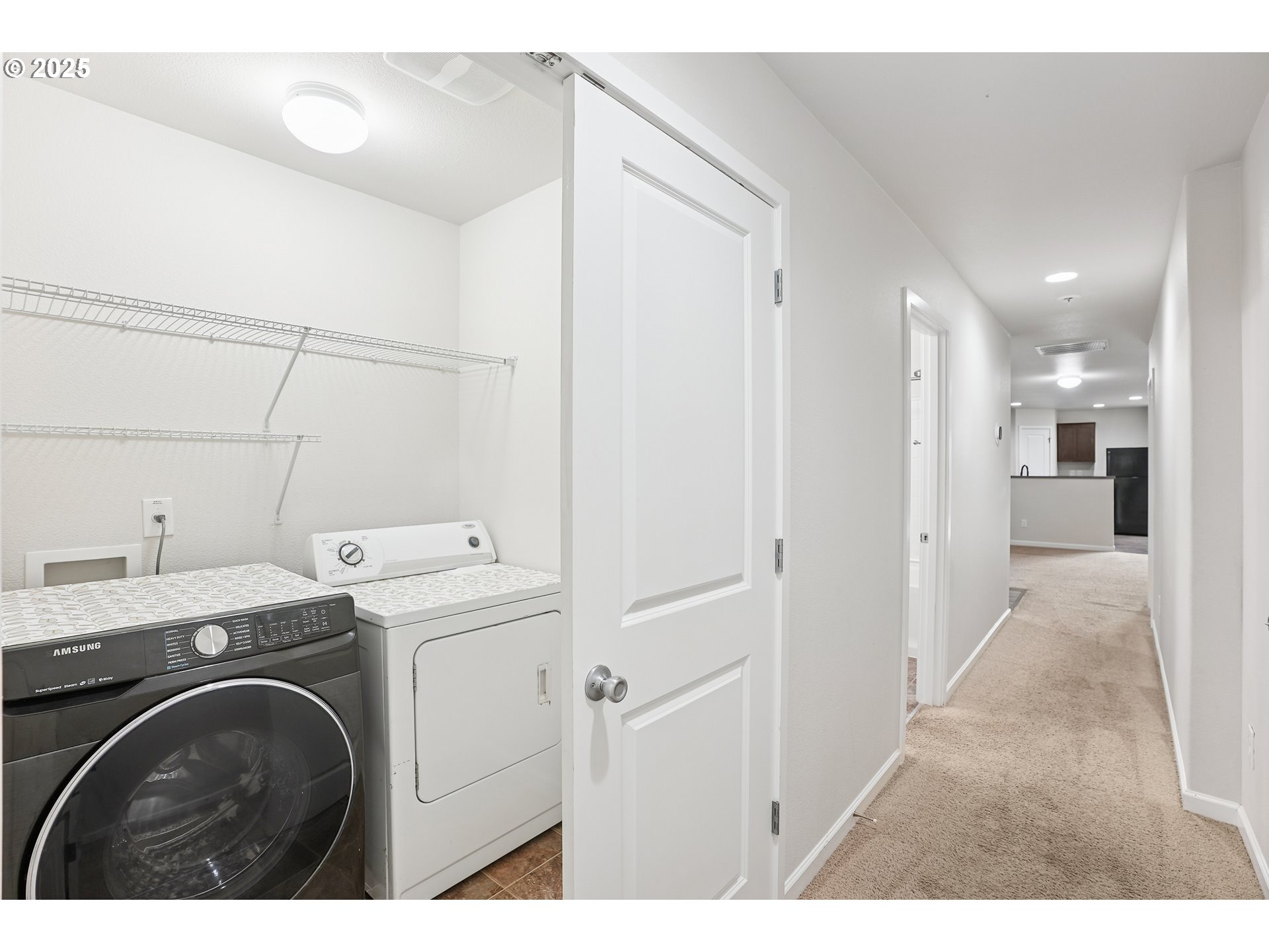902 South View Drive Molalla, OR 97038 - Photo 11 of 24 a view of a hallway with washer and dryer