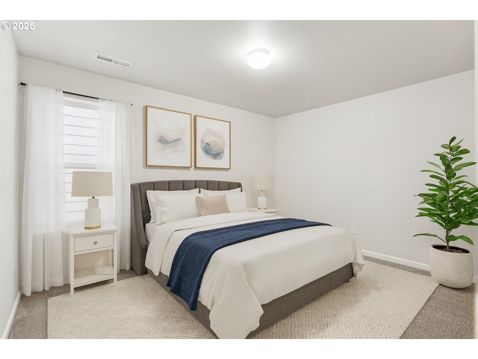 902 South View Drive Molalla, OR 97038 - Photo 13 of 24 a bedroom with a bed and a potted plant