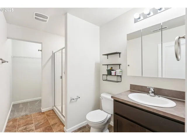 a bathroom with a sink toilet and a mirror
