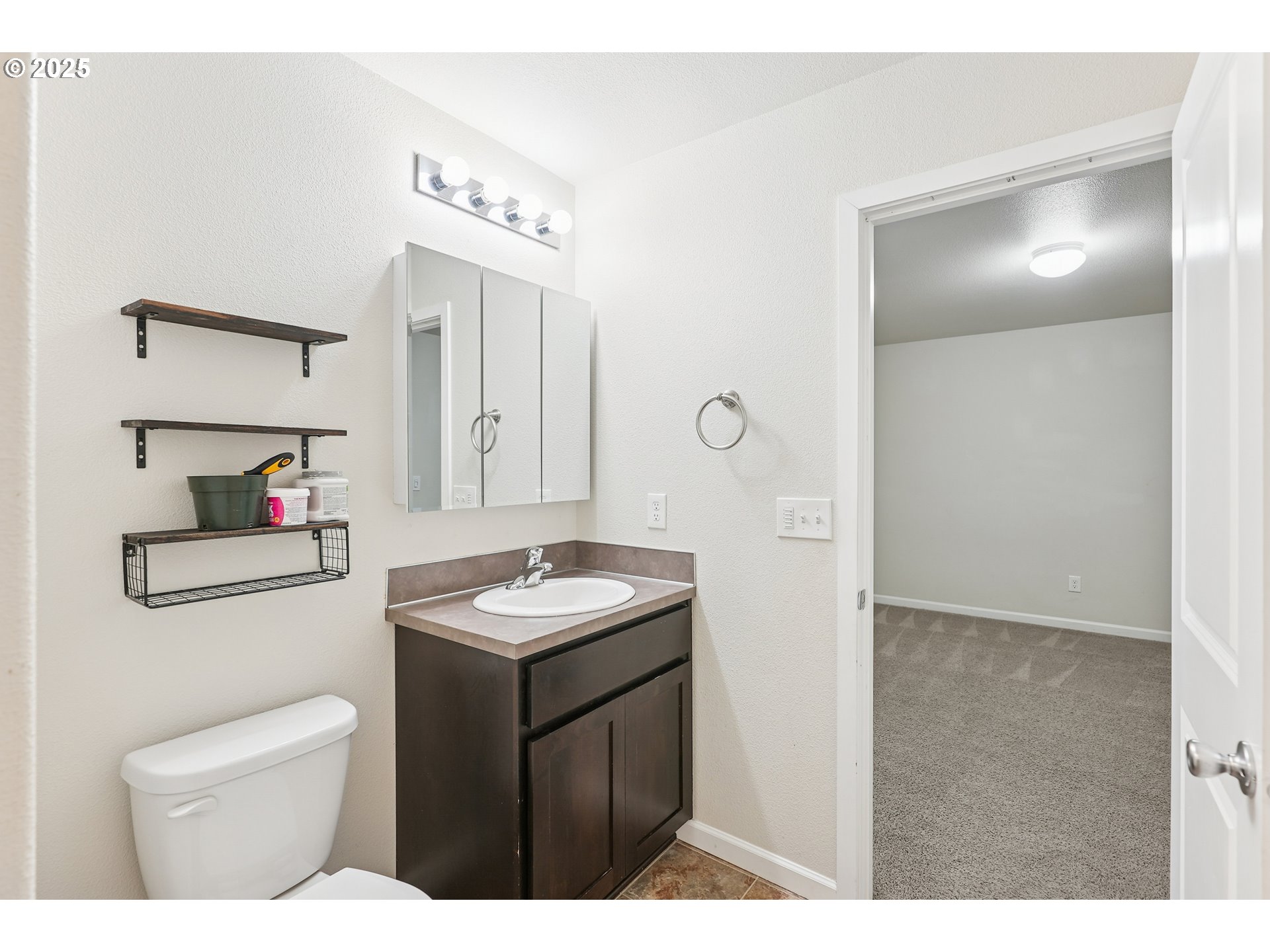 902 South View Drive Molalla, OR 97038 - Photo 16 of 24 a bathroom with a sink a toilet and mirror