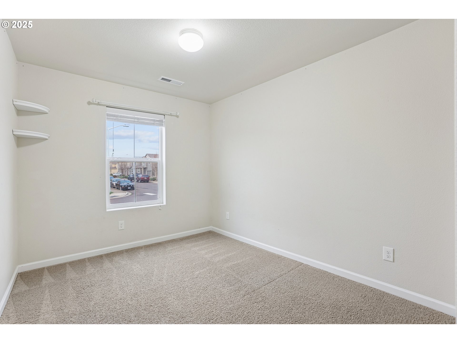 902 South View Drive Molalla, OR 97038 - Photo 18 of 24 a view of an empty room with a window