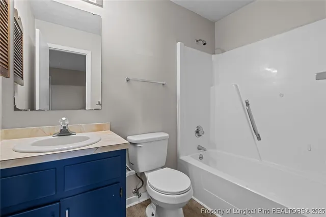 a bathroom with a toilet a sink and a bathtub