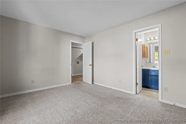 an empty room with closet area