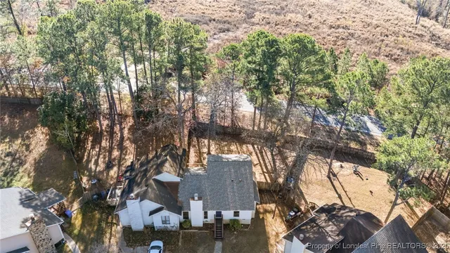 a view of a balcony with wooden floor and fence