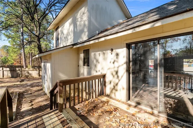 a backyard of a house with lots of trees