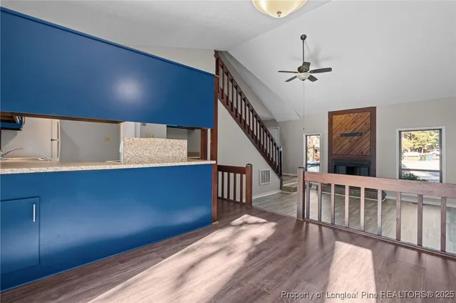 a view of an entryway with wooden floor