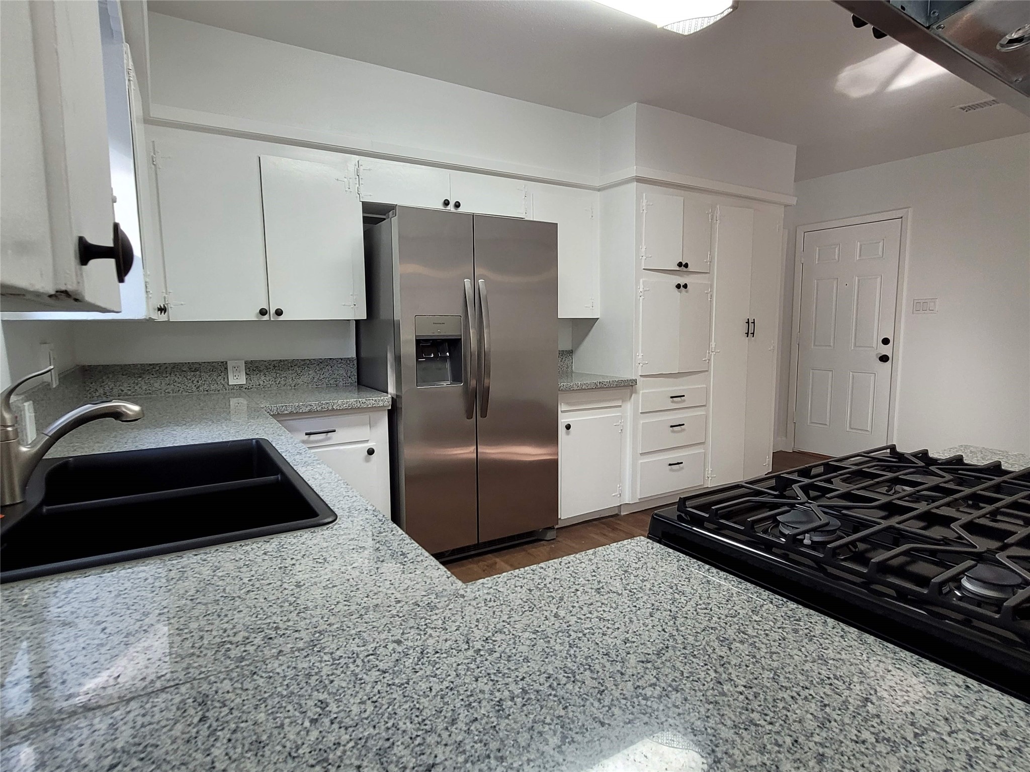 4302 Dickson Street Houston, TX 77007 - Photo 15 of 21 a kitchen with a stove a refrigerator and a sink