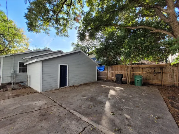 a view of a house with a yard and garage