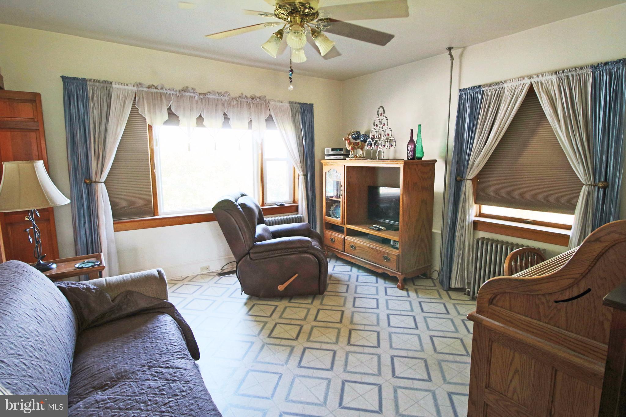 12949 Detour Road Keymar, MD 21757 - Photo 11 of 30 a living room with furniture and a flat screen tv