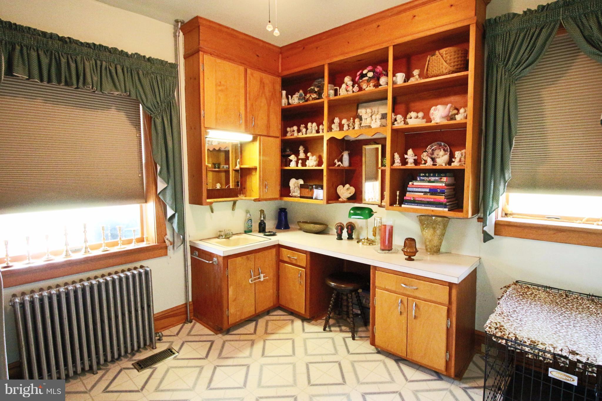 12949 Detour Road Keymar, MD 21757 - Photo 12 of 30 a kitchen with a sink stove and cabinets