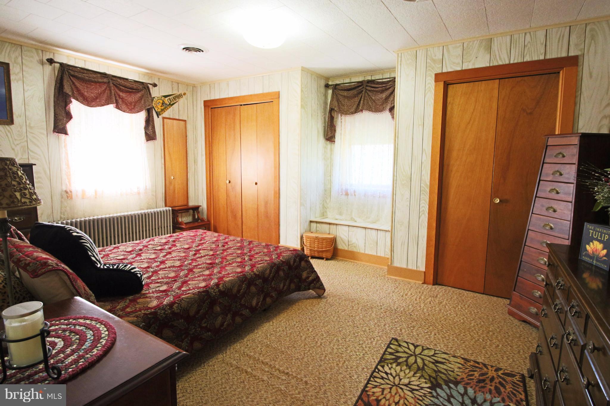 12949 Detour Road Keymar, MD 21757 - Photo 13 of 30 a bedroom with a bed and wooden floor