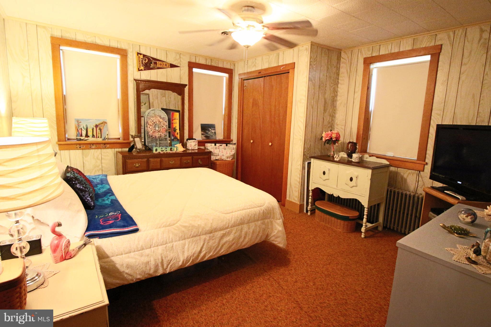 12949 Detour Road Keymar, MD 21757 - Photo 14 of 30 a bedroom with a bed and a chandelier