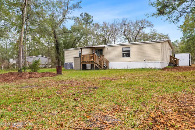 a backyard of a house with lots of green space