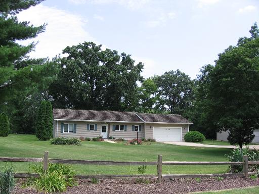 3708 East 25th Road Serena, IL 60549 - Photo 1 of 1 a front view of a house with a garden