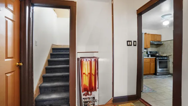 a bedroom with furniture and wooden floor