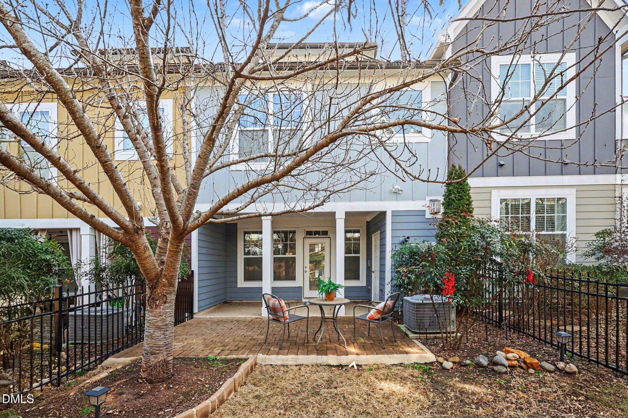 653 Fallon Grove Way Raleigh, NC 27608 - Photo 29 of 38 a view of a house with a bench in a patio