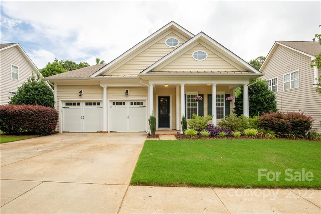 932 Treasure Court Fort Mill, SC 29708 - Photo 1 of 34 a view of a white house with a big yard and potted plants