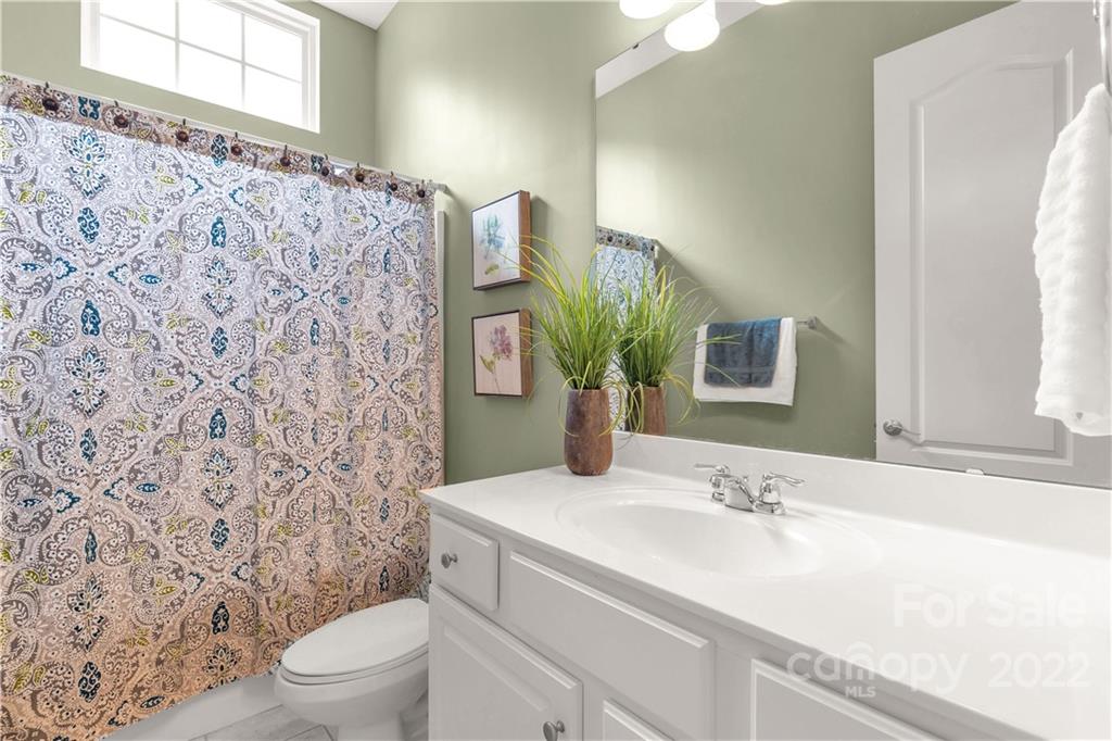 932 Treasure Court Fort Mill, SC 29708 - Photo 20 of 34 a bathroom with a sink toilet and shower