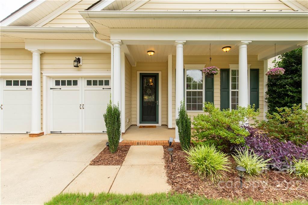 932 Treasure Court Fort Mill, SC 29708 - Photo 2 of 34 a front view of a house with garden