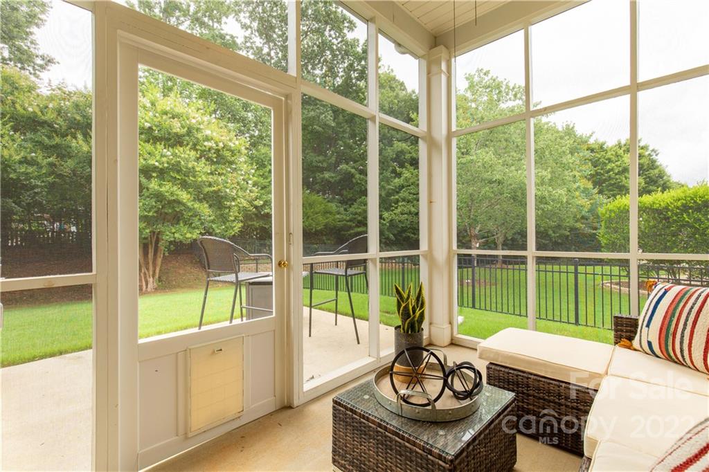 932 Treasure Court Fort Mill, SC 29708 - Photo 24 of 34 a living room with furniture and floor to ceiling windows