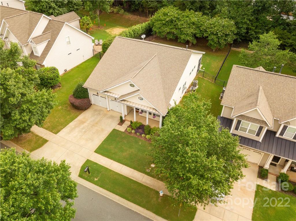 932 Treasure Court Fort Mill, SC 29708 - Photo 29 of 34 an aerial view of a house with a yard and pool