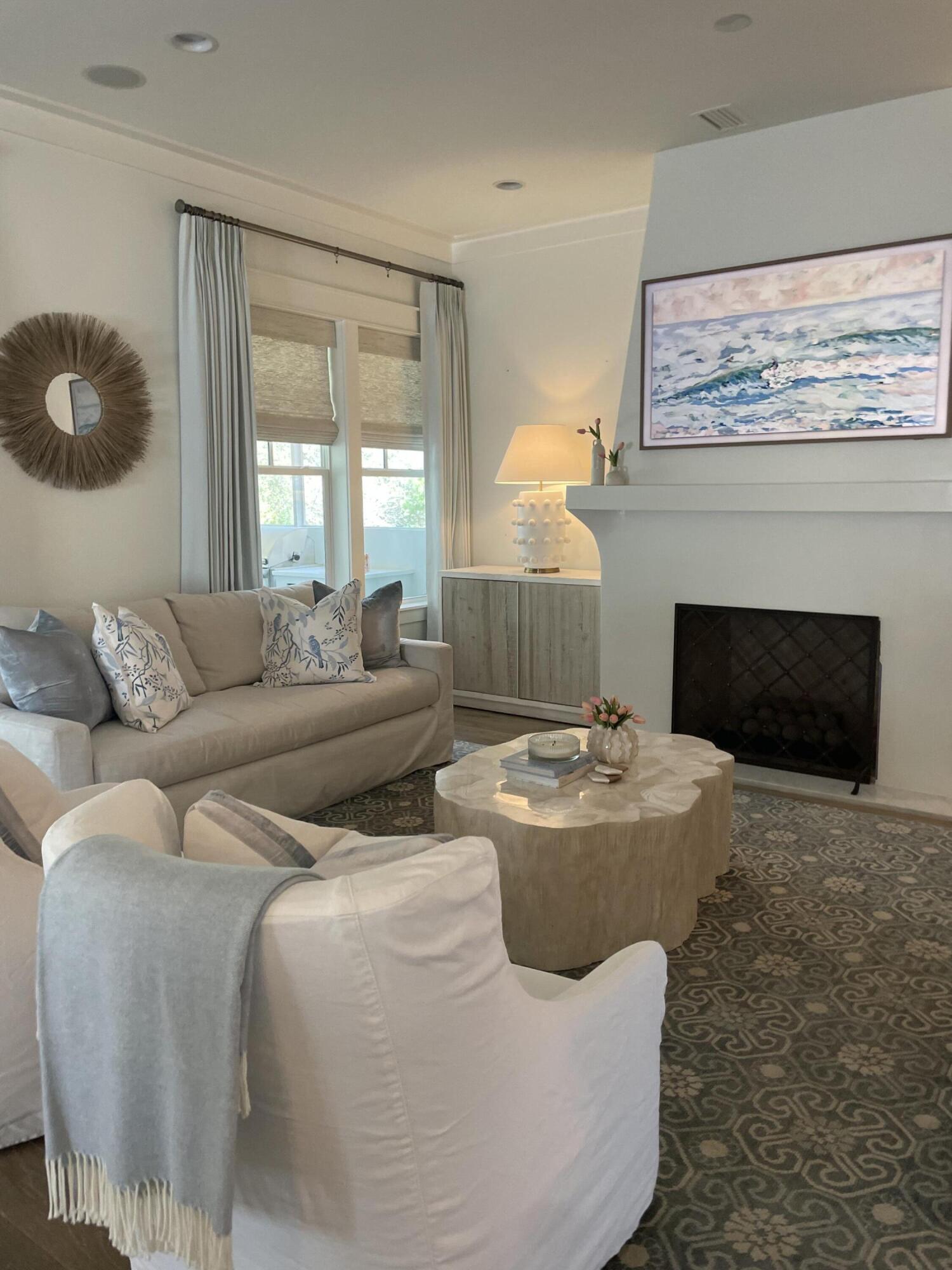 165 Splash Drive Inlet Beach, FL 32461 - Photo 4 of 8 a living room with couches a fireplace and a large window
