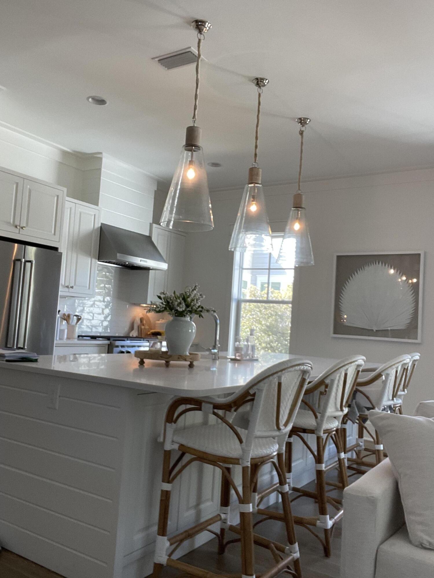 165 Splash Drive Inlet Beach, FL 32461 - Photo 6 of 8 a kitchen with a table and chairs in it