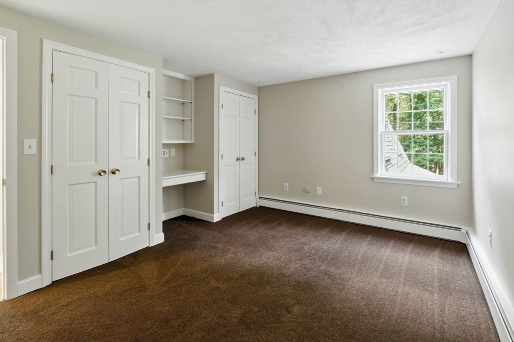 28 Janes Road Boxford, MA 01921 - Photo 13 of 41 an empty room with a hardwood and a window