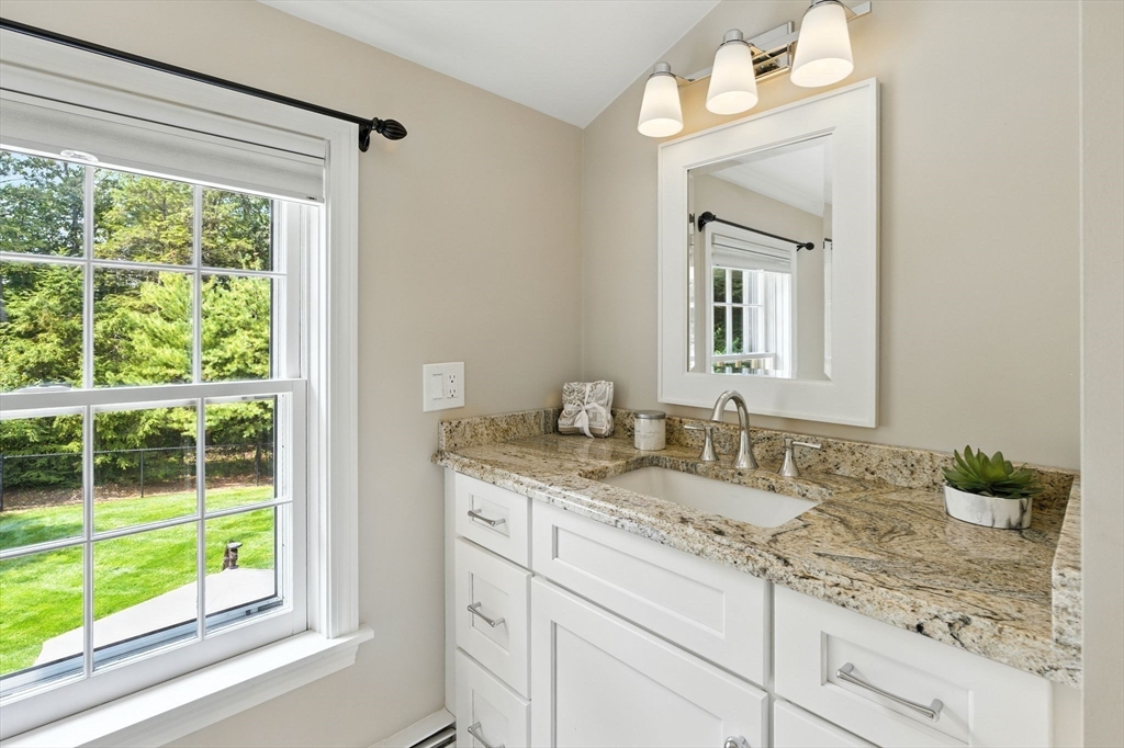 28 Janes Road Boxford, MA 01921 - Photo 14 of 41 a bathroom with a granite countertop sink and a mirror