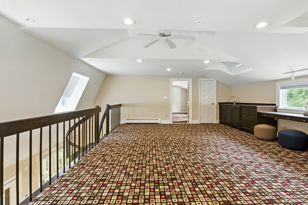 28 Janes Road Boxford, MA 01921 - Photo 16 of 41 a bedroom with a bed and cabinets