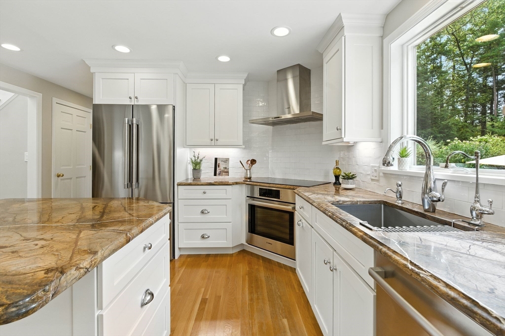 28 Janes Road Boxford, MA 01921 - Photo 2 of 41 a kitchen with a sink stove and refrigerator