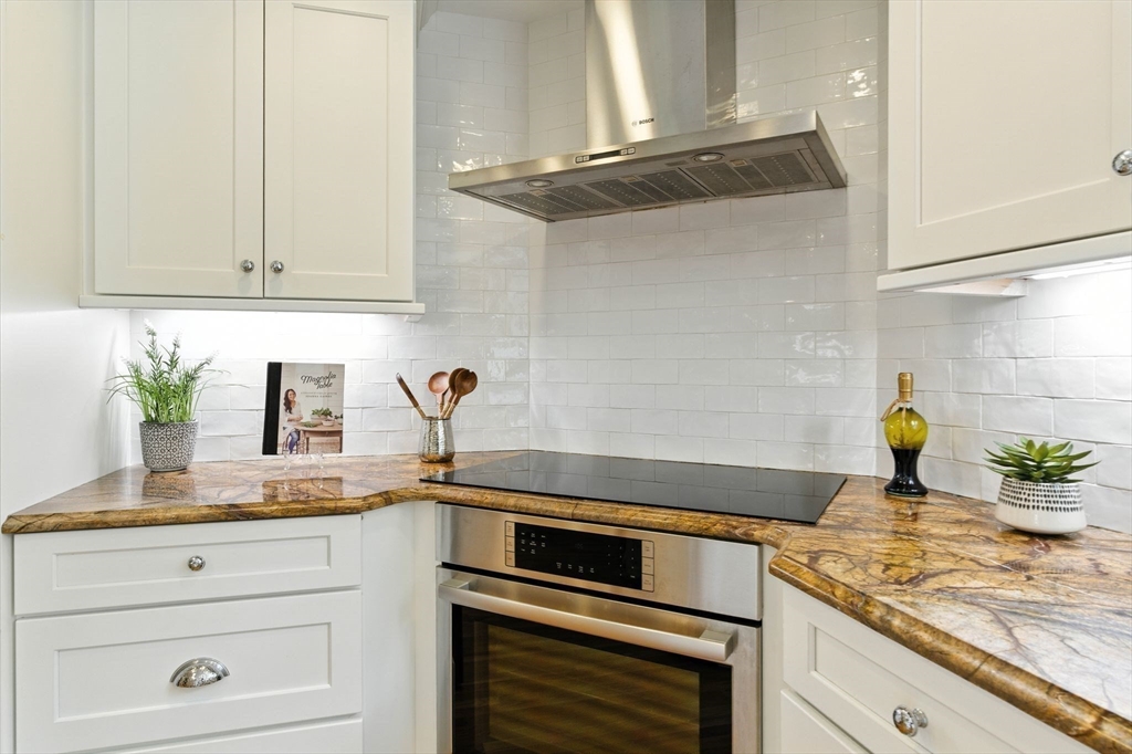 28 Janes Road Boxford, MA 01921 - Photo 26 of 41 a kitchen with stainless steel appliances granite countertop a sink and cabinets