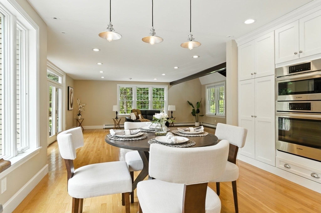 28 Janes Road Boxford, MA 01921 - Photo 28 of 41 a dining room with furniture a large window and kitchen view