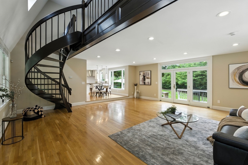28 Janes Road Boxford, MA 01921 - Photo 8 of 41 a living room with furniture wooden floor and a floor to ceiling window