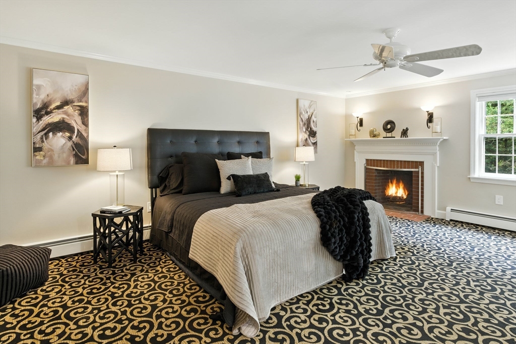 28 Janes Road Boxford, MA 01921 - Photo 9 of 41 a bedroom with a bed and a fireplace