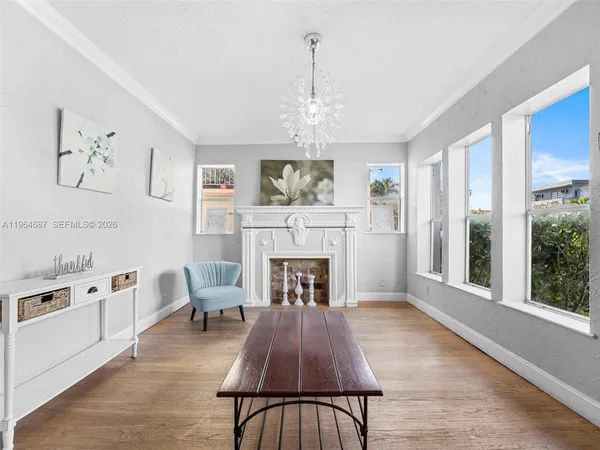 a living room with furniture fireplace and window