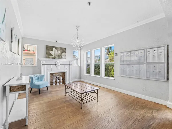 a living room with furniture and a fireplace