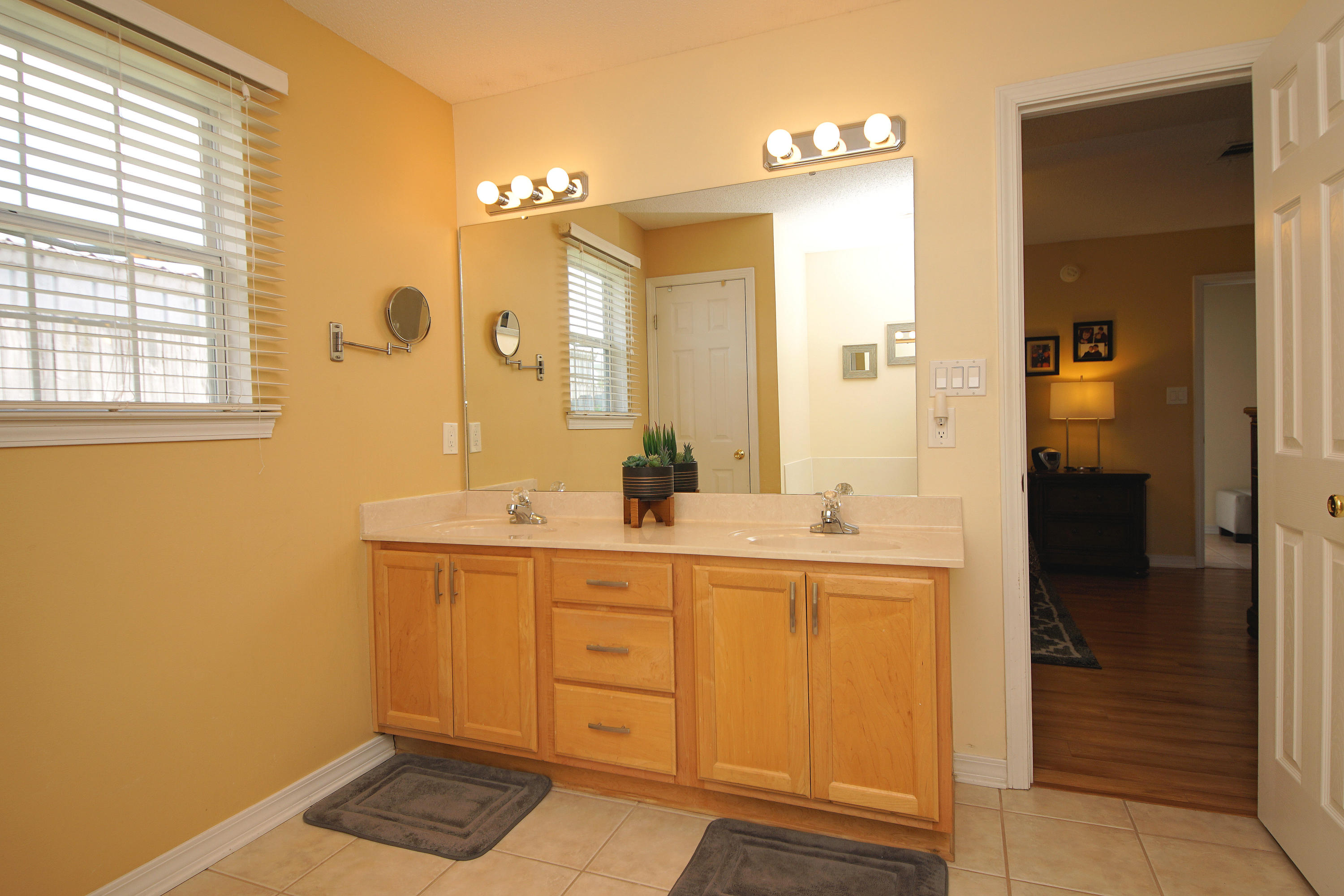 1956 Woodcrest Ridge Fort Walton Beach, FL 32547 - Photo 13 of 23 a spacious bathroom with a sink and a mirror